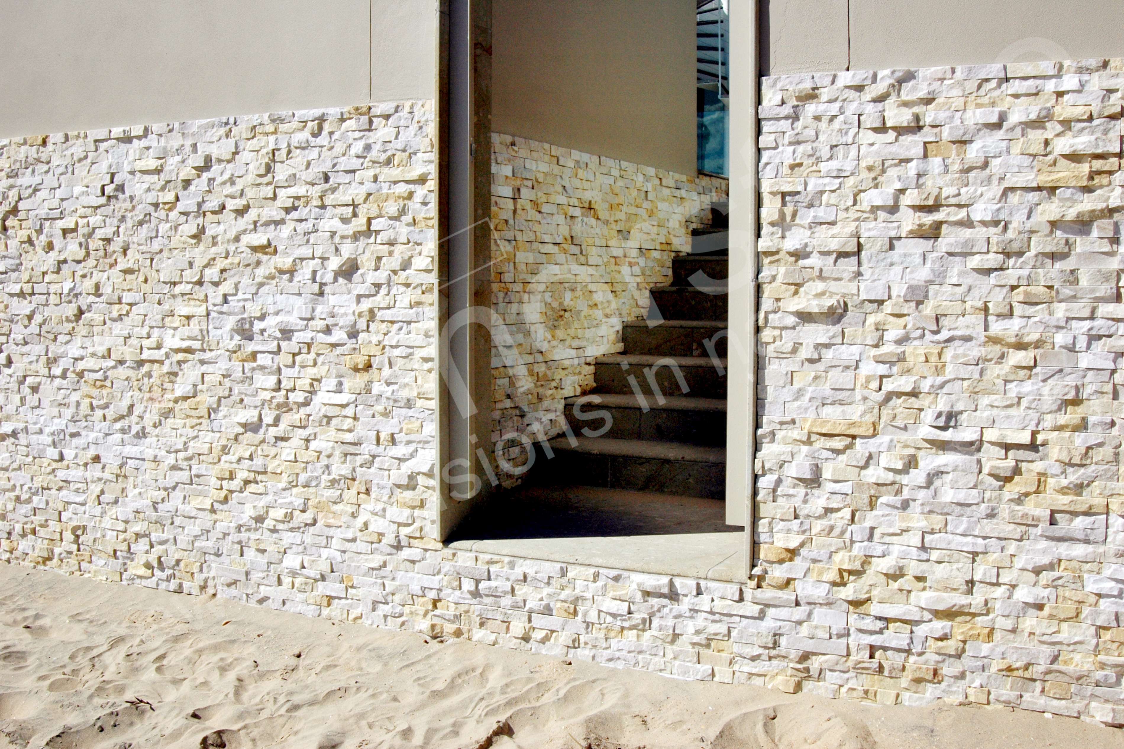 Norstone Ivory Rock Panels on a coastal sea wall with steps leading to residential backyard near Sydney, Australia